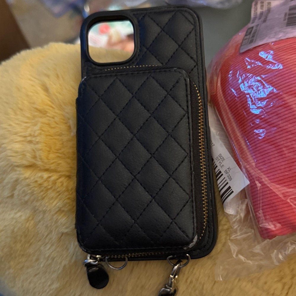 Black Phone Case with Strap, has 9 card pockets inside a zipper compartment.